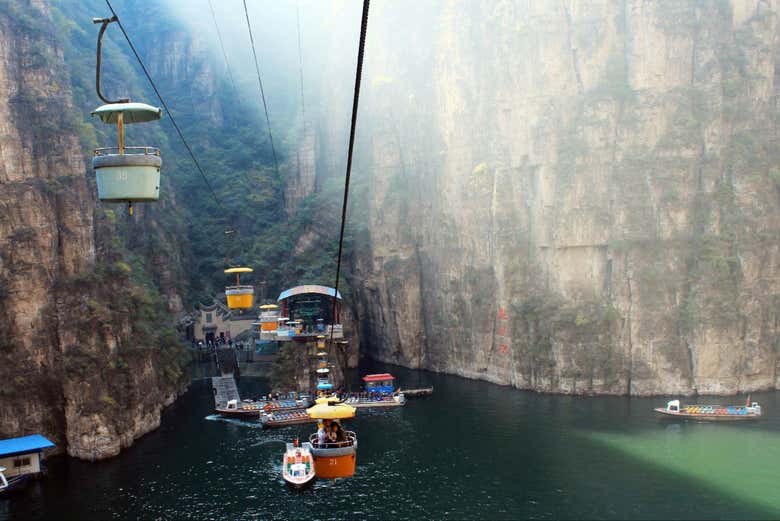 Spot the colourful cable car over the gorge